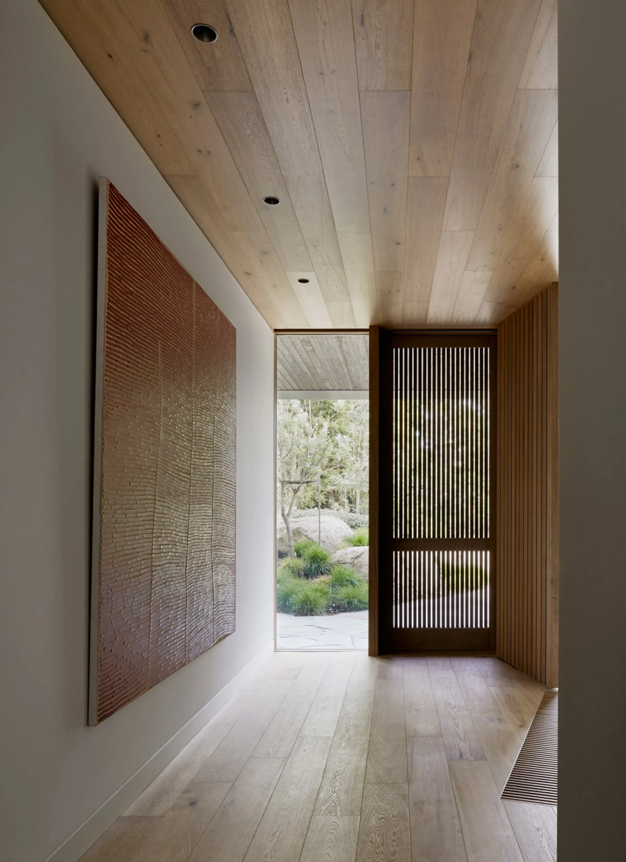 Corridor with long view and window at the end.