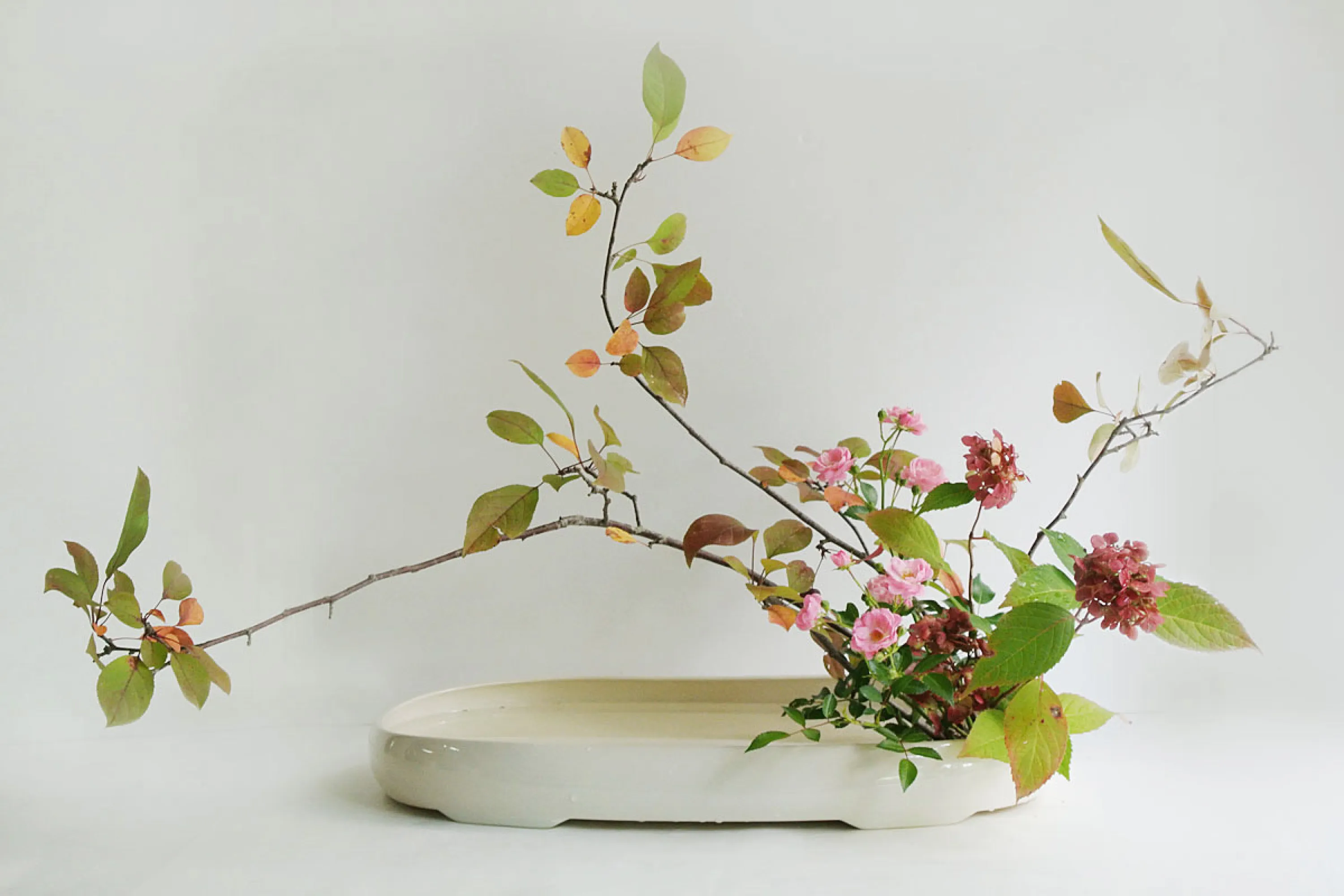 Ikebana arrangement made of local leaves and flowers.