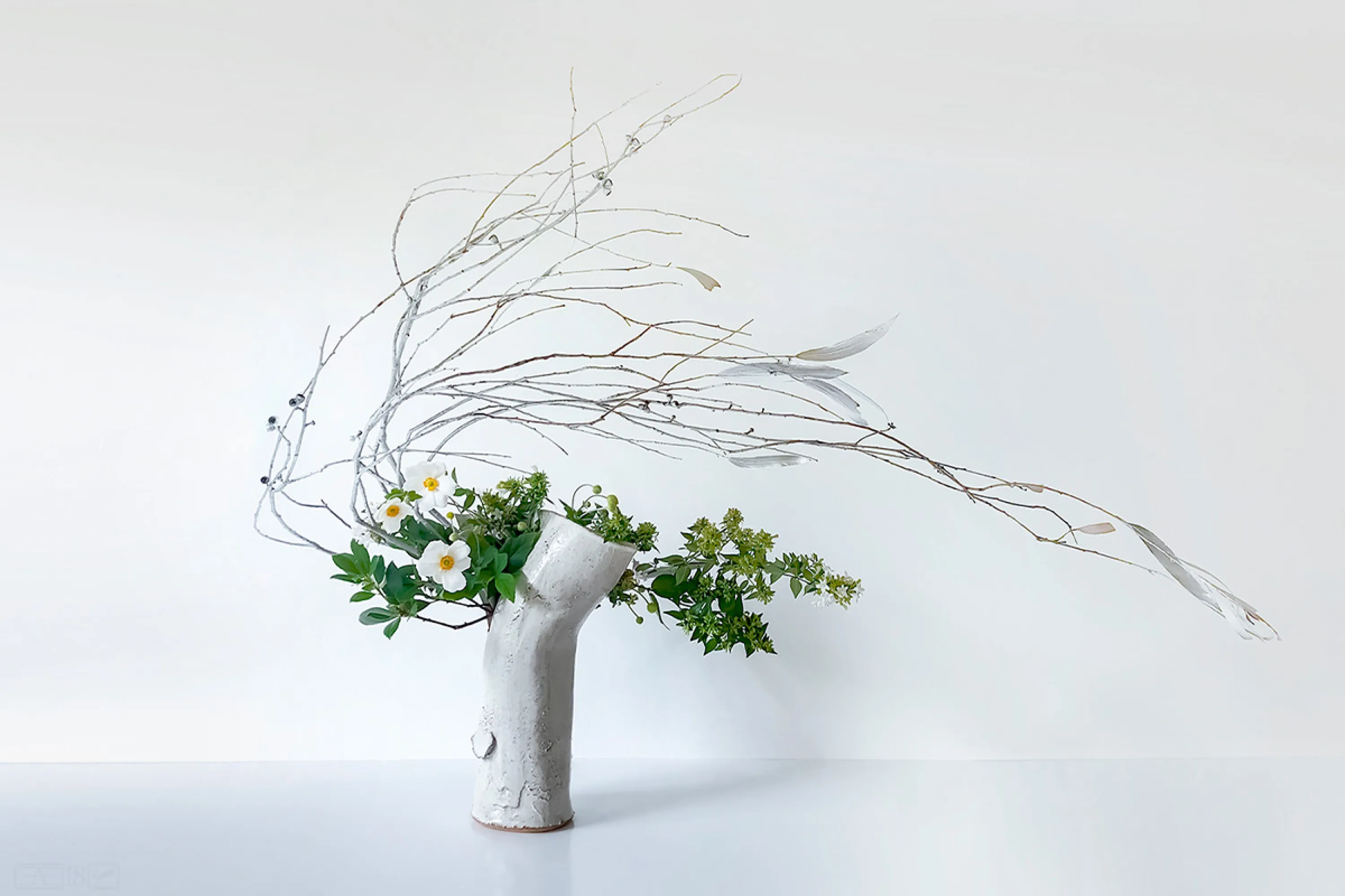 Ikebana arrangement with highly bent stems.