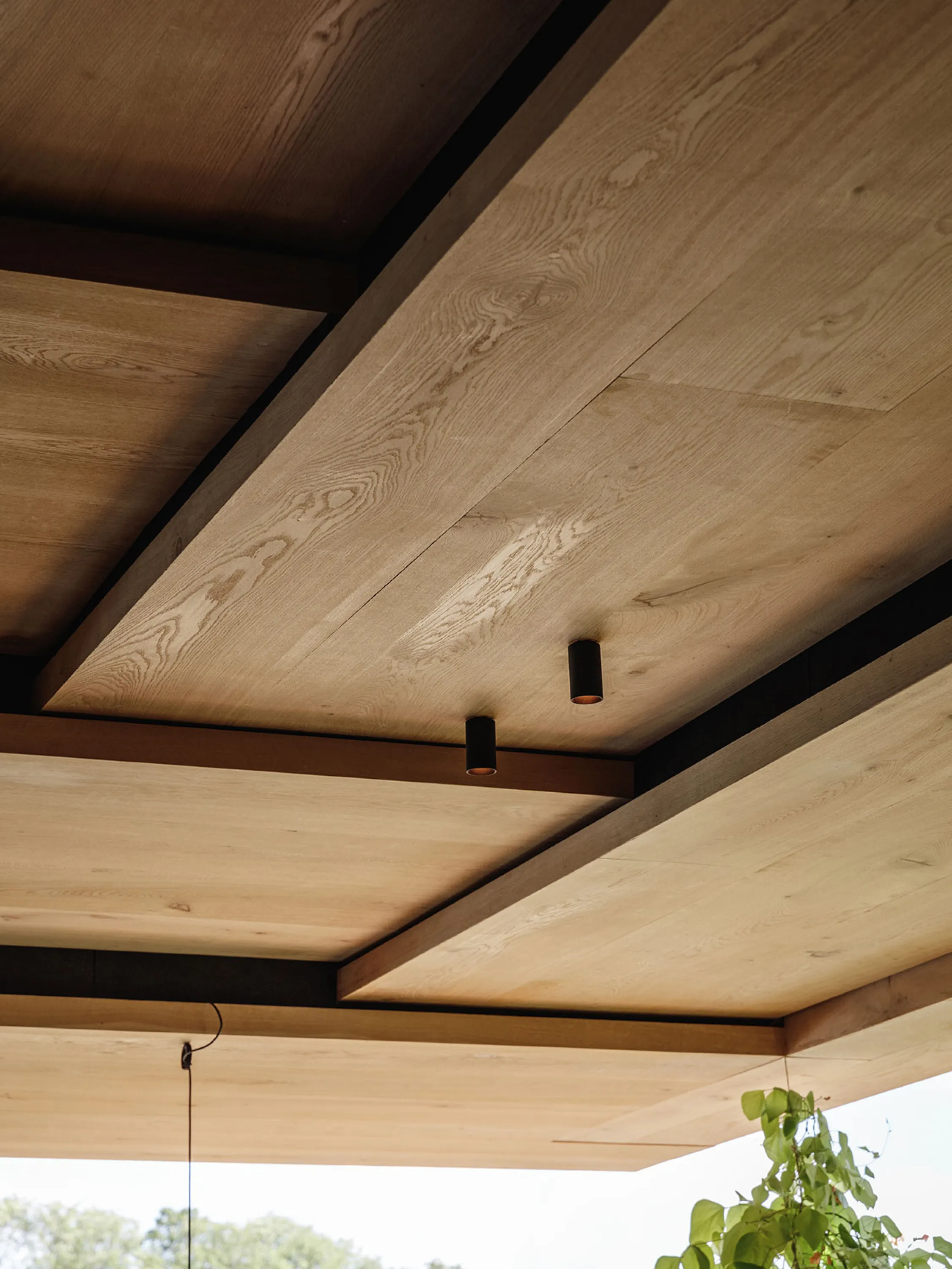 A wooden ceiling made with overlapped planks of wood.