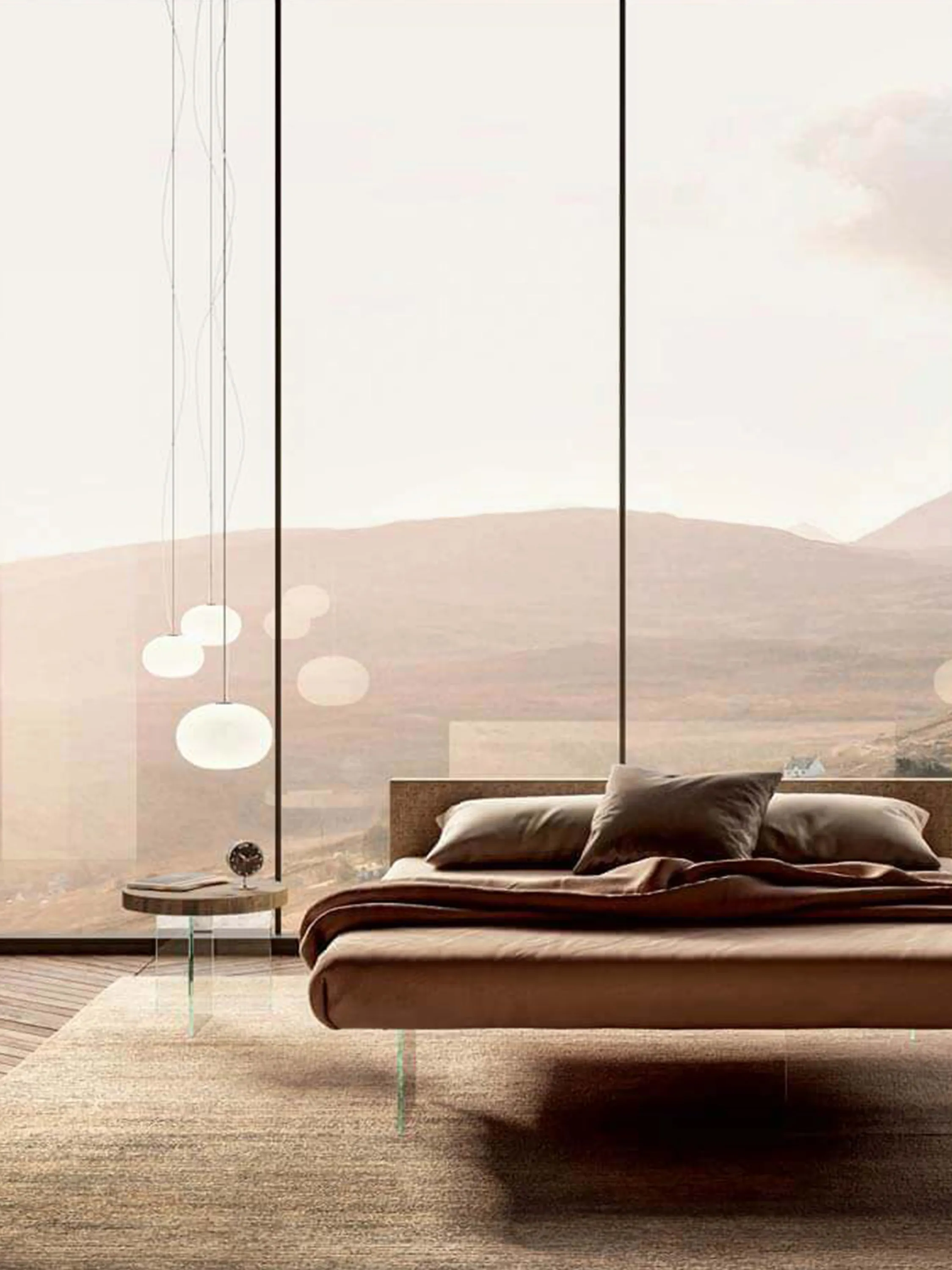 Bed with clear glass legs and floor-to-ceiling window overlooking a steep cliff.