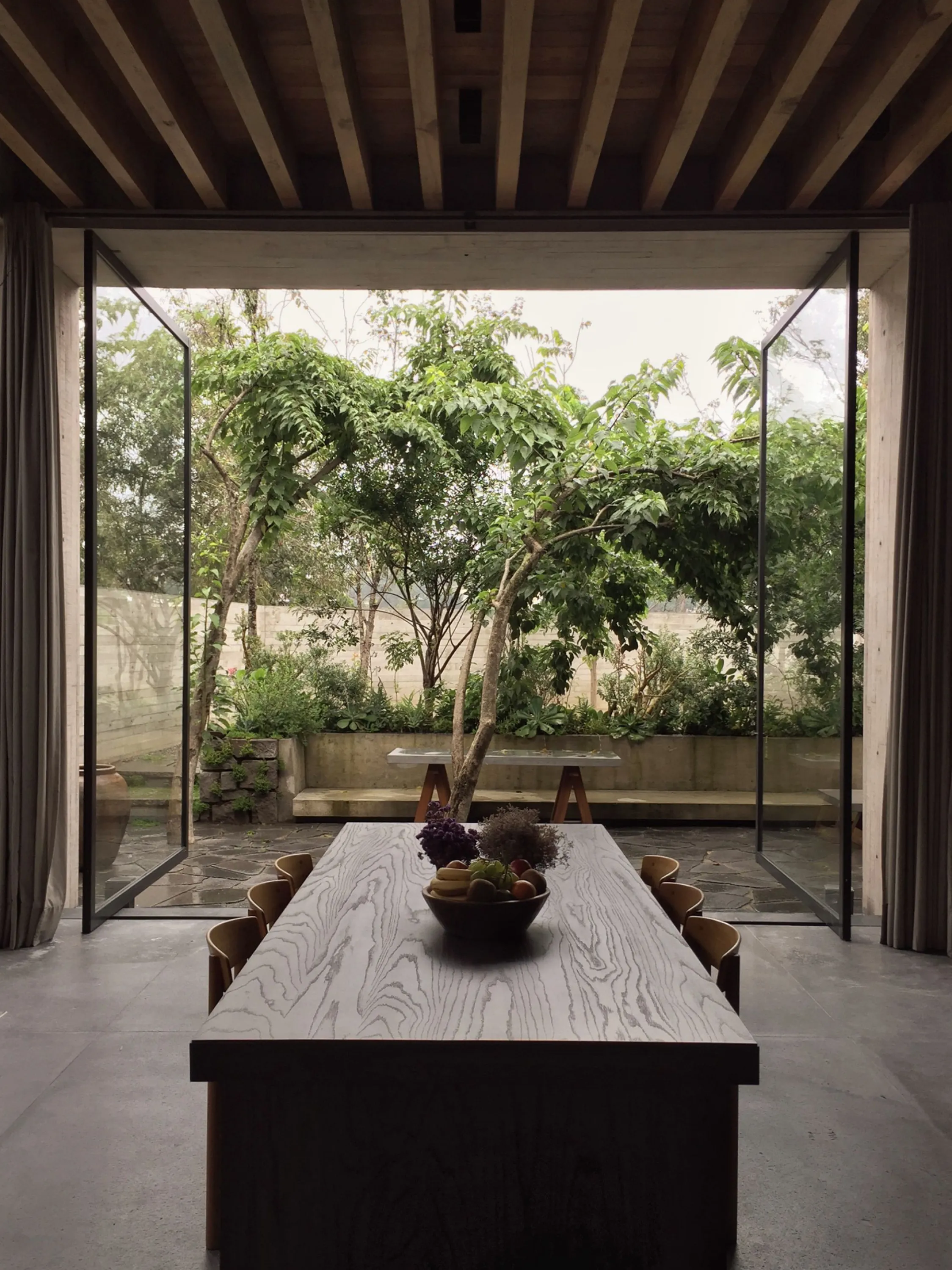 Dining room with full windows overlooking the garden.
