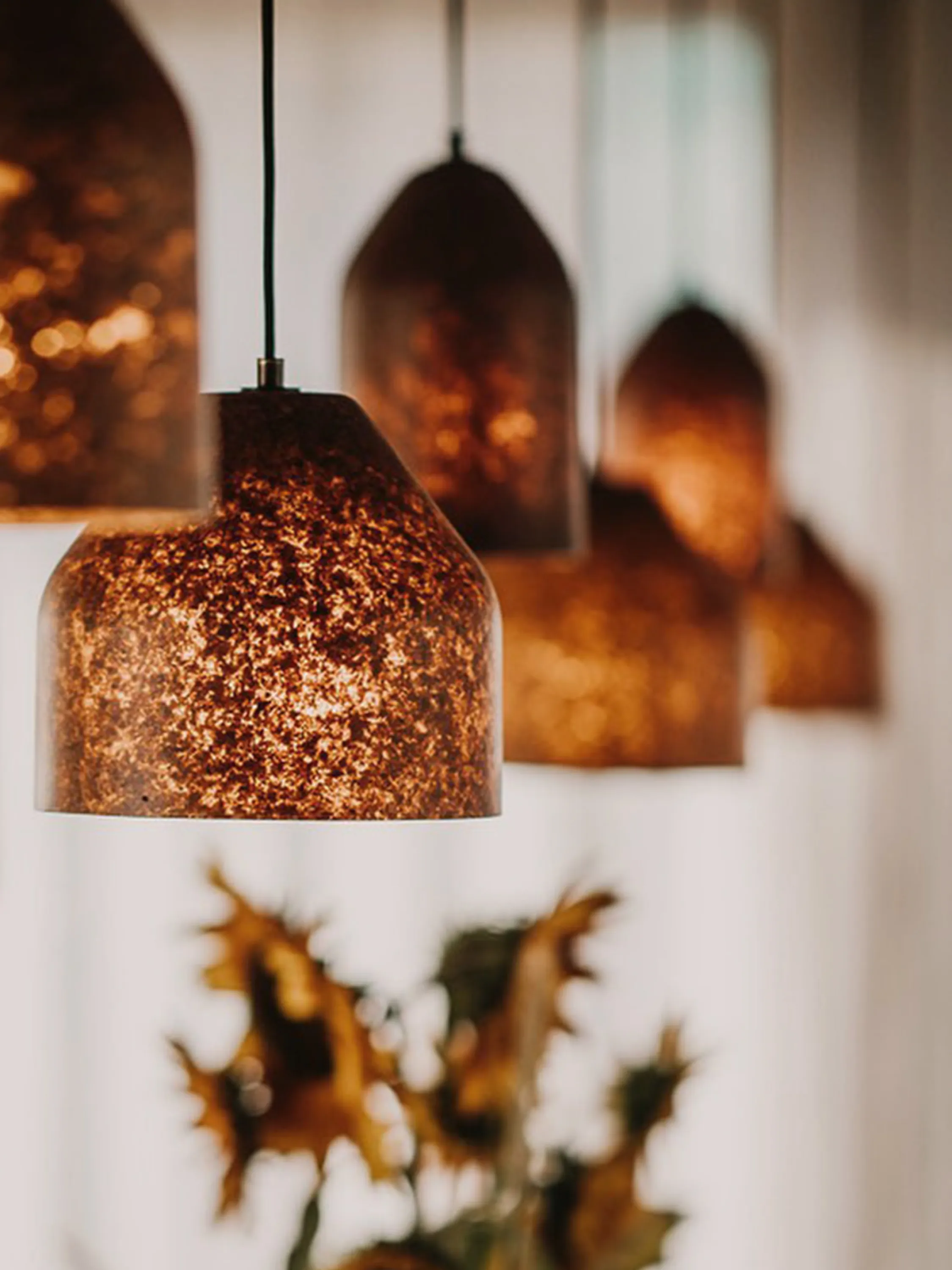 Pendant lamps made with fallen leaves.