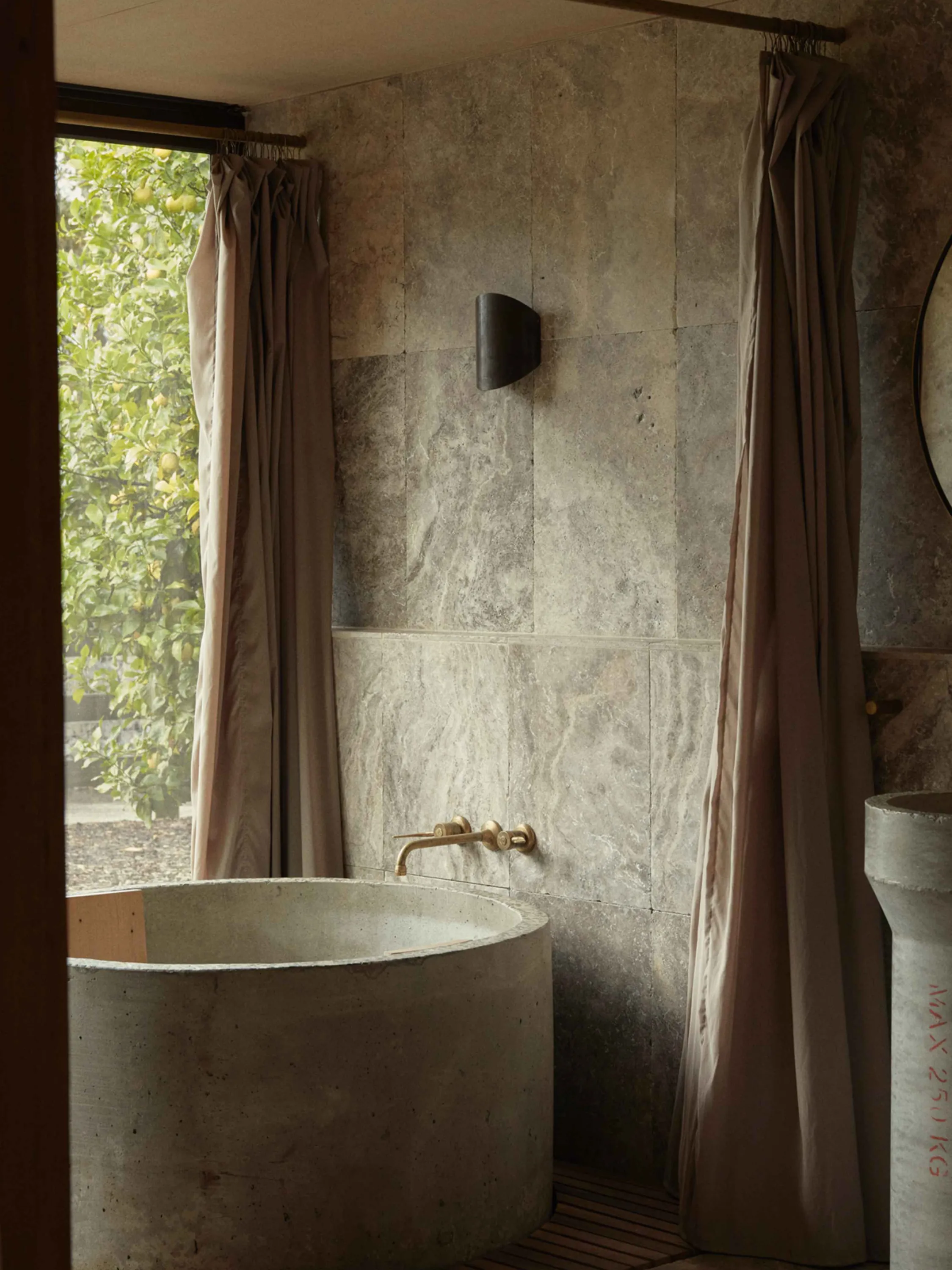 Bathtub nested in a secluded alcove with an open view.