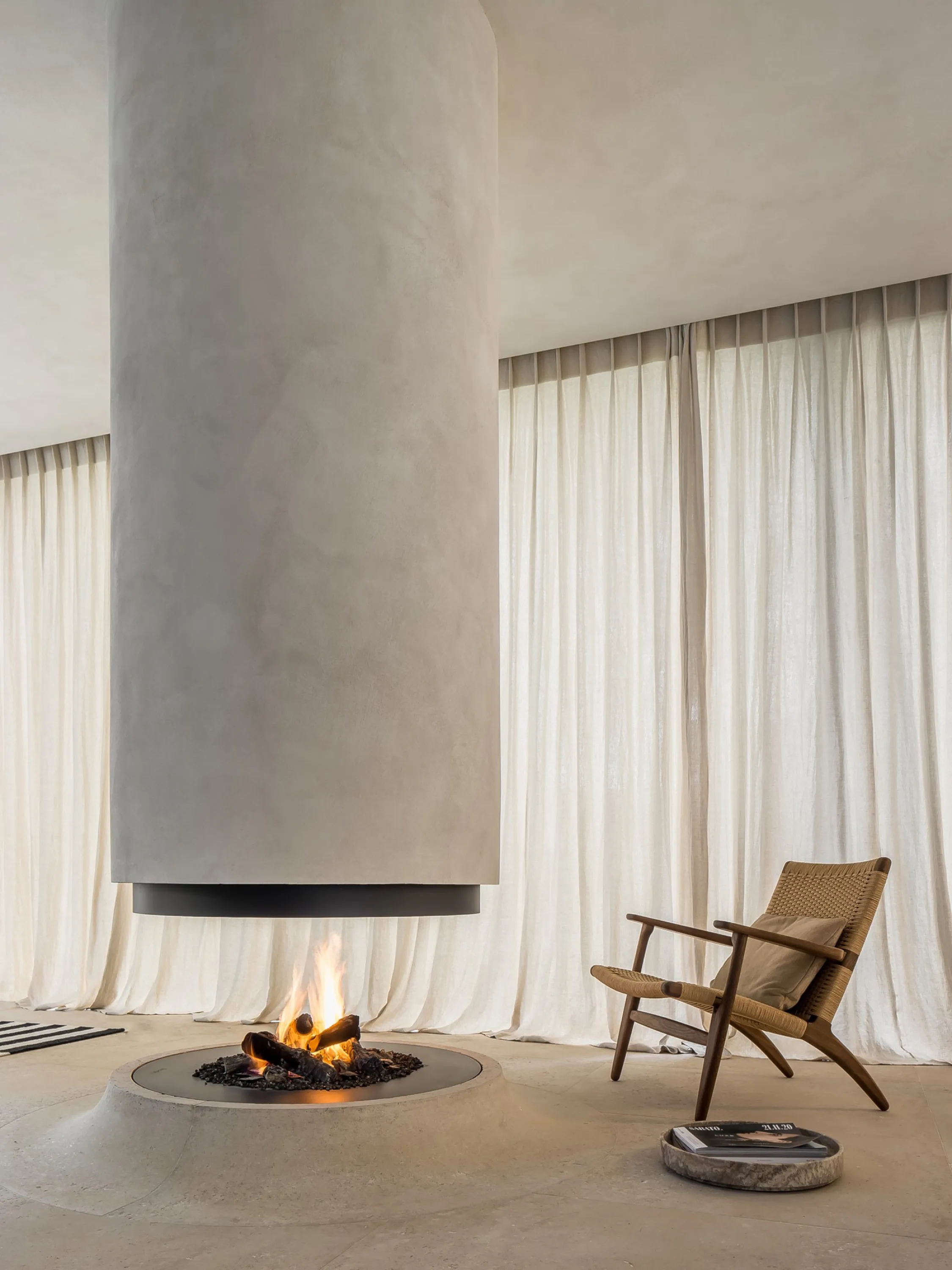 Minimal fireplace raising from the floor.