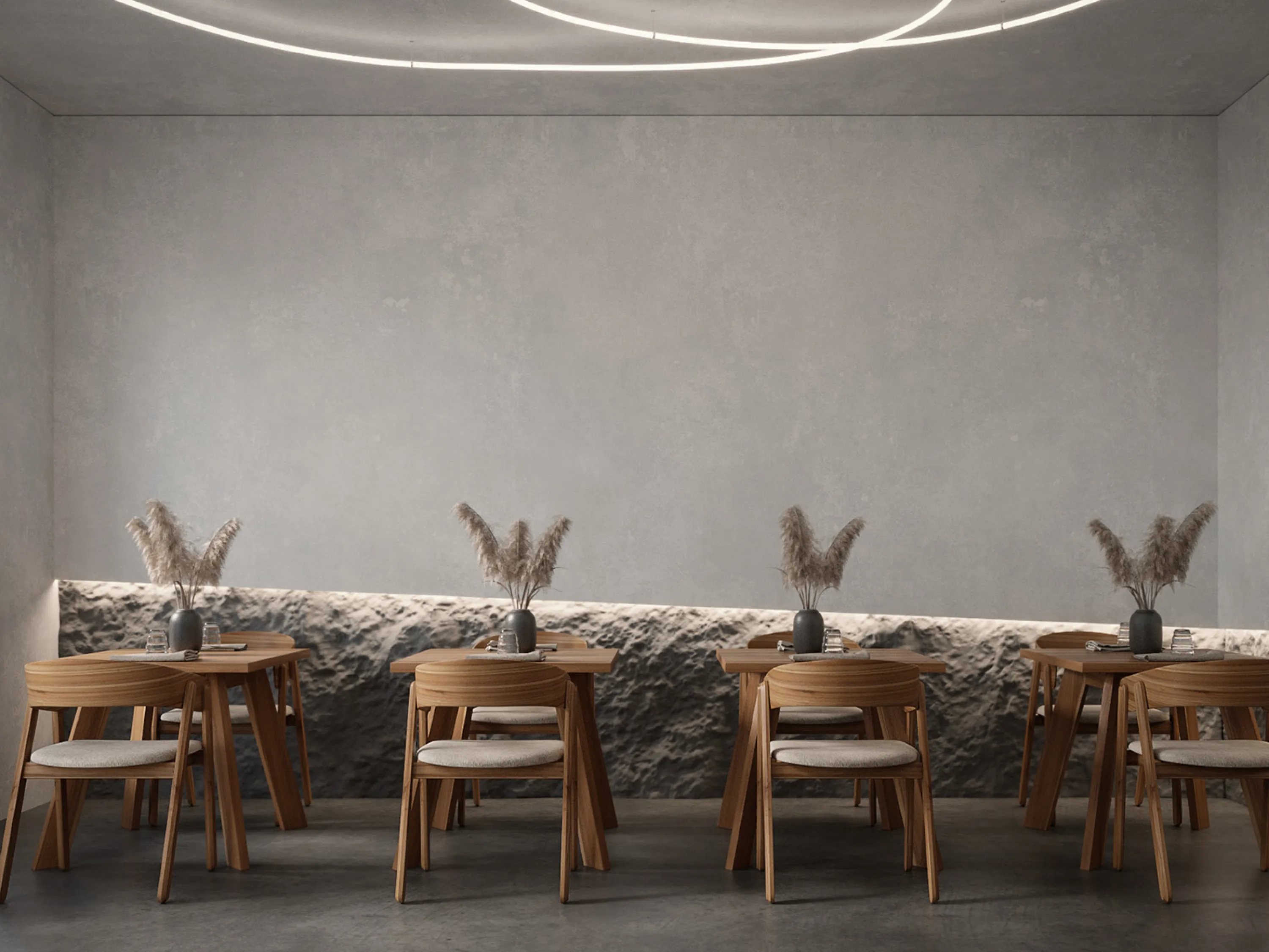 Restaurant with textured walls and a raw stone moulding.