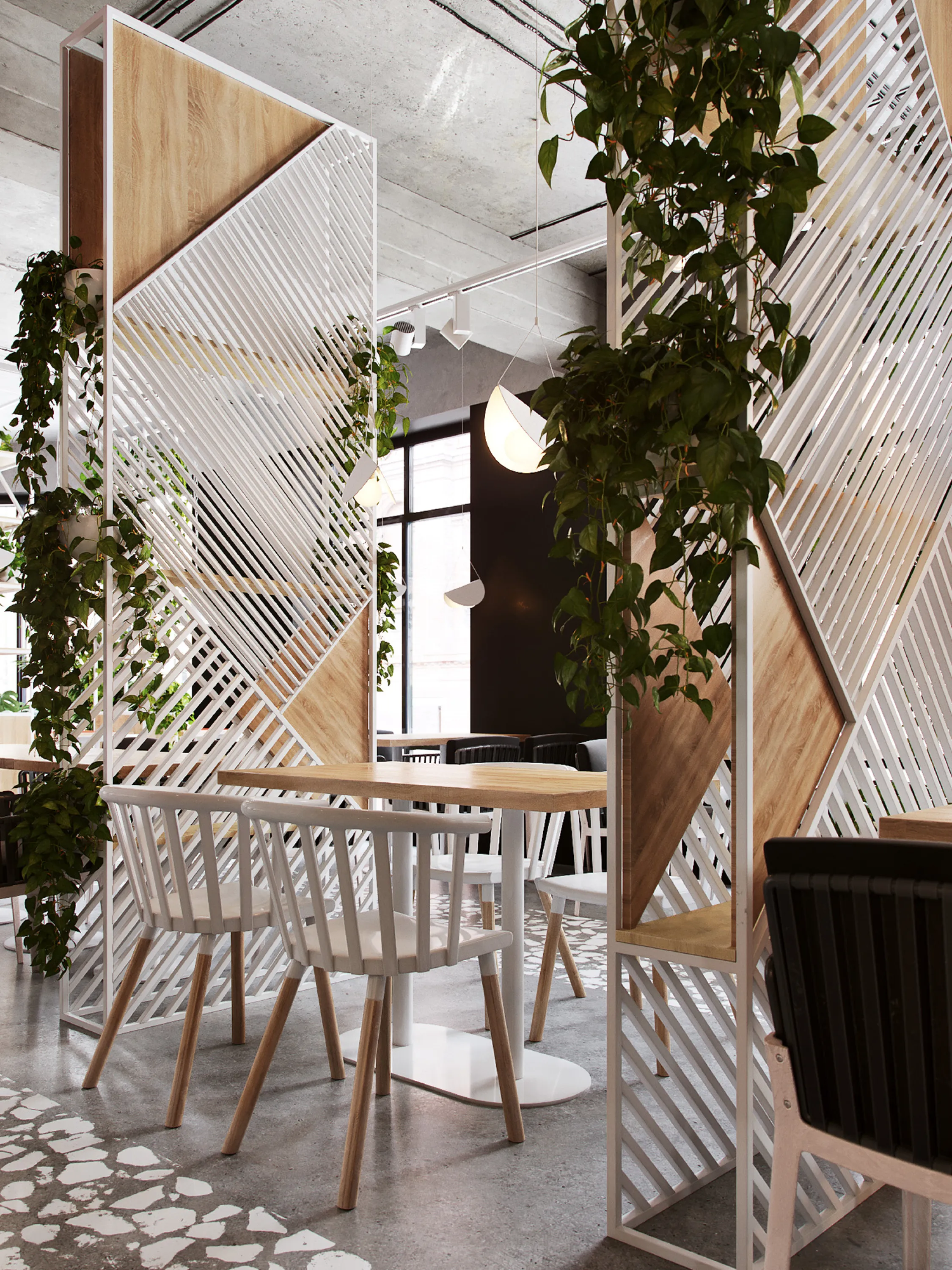 Restaurant tables separated by tall planted dividers.