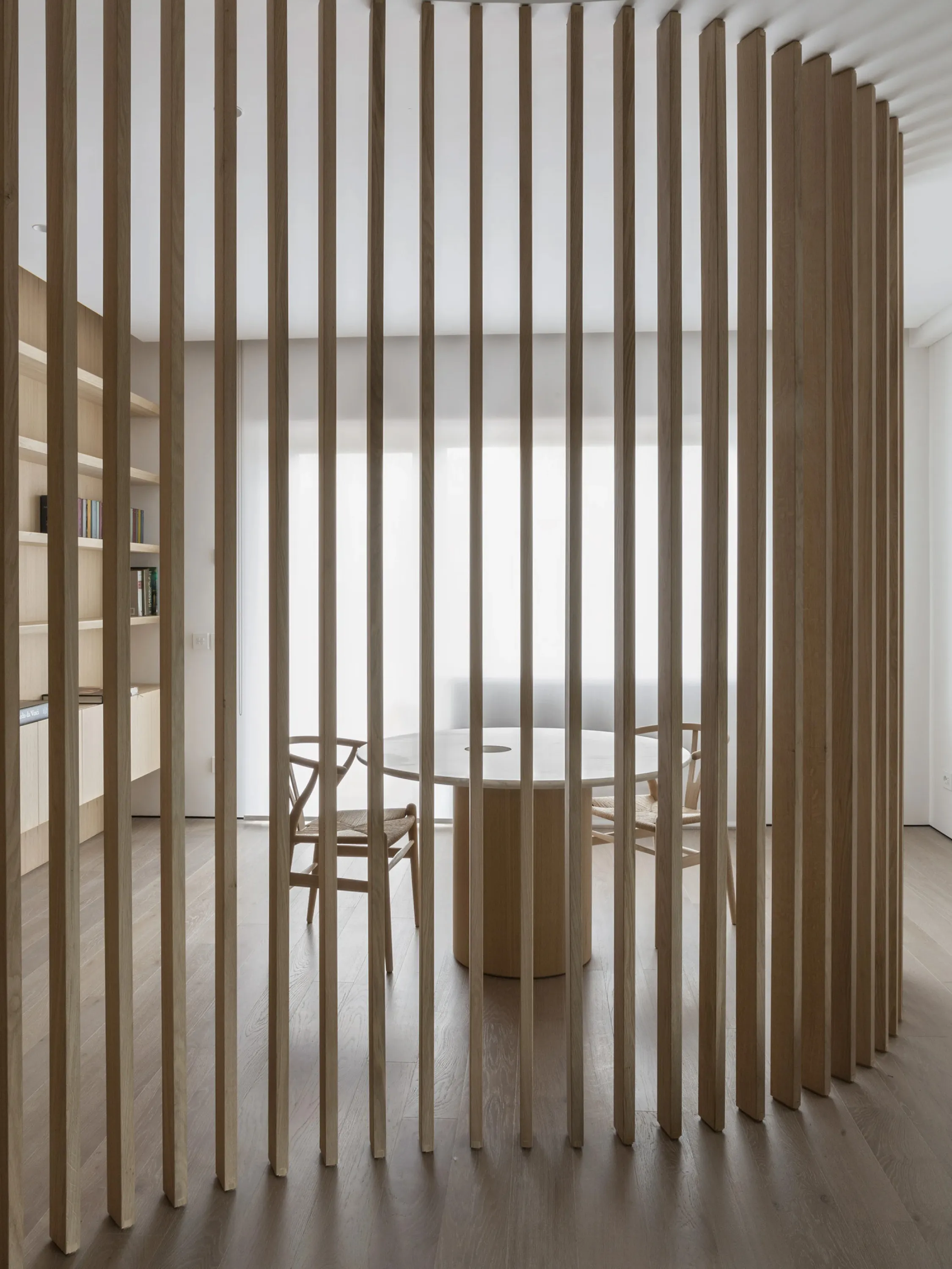 Working space unclosed within a slatted wood partition.