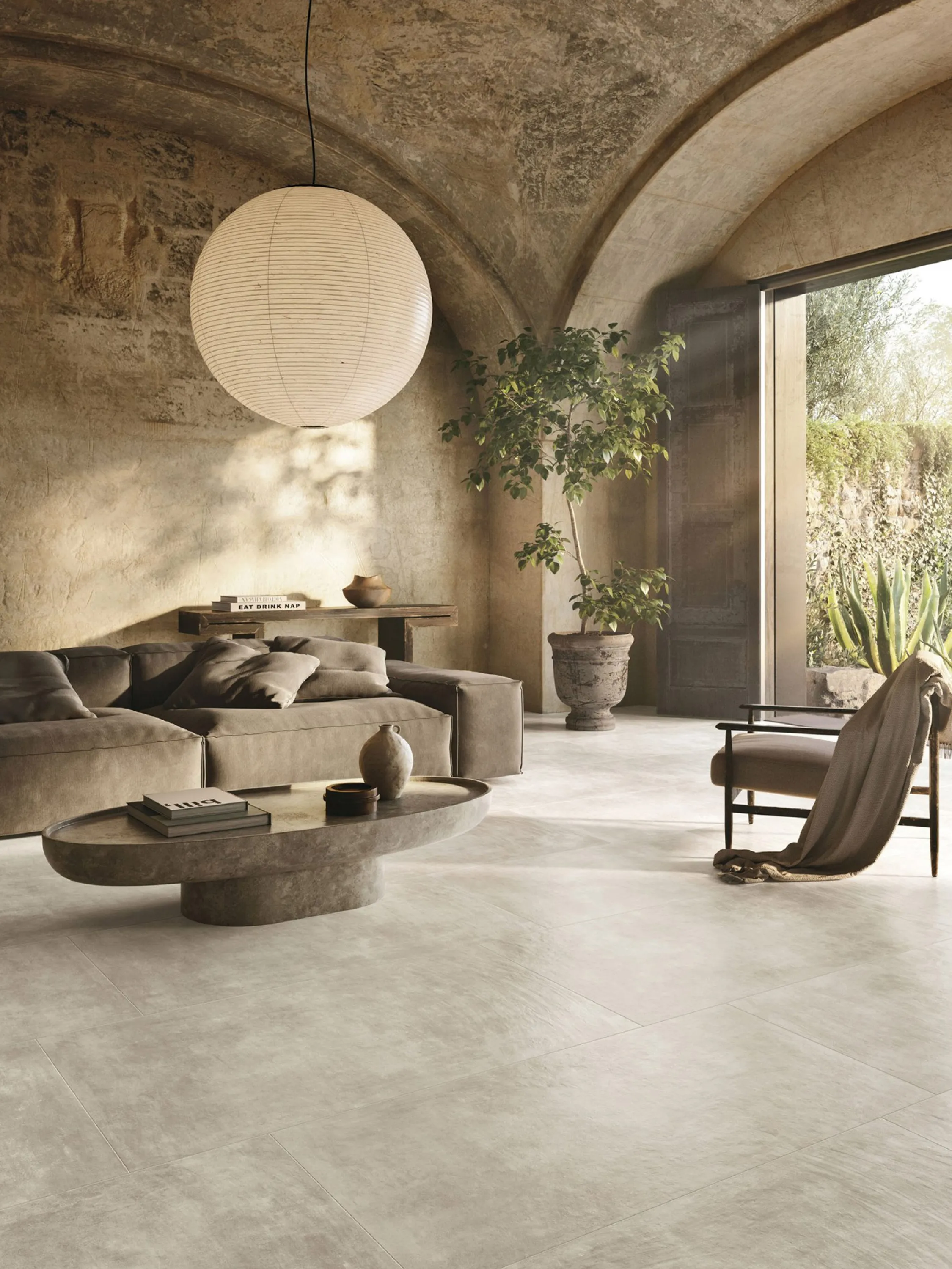 Living room with soft juxtaposed textures and historical archietctural features.