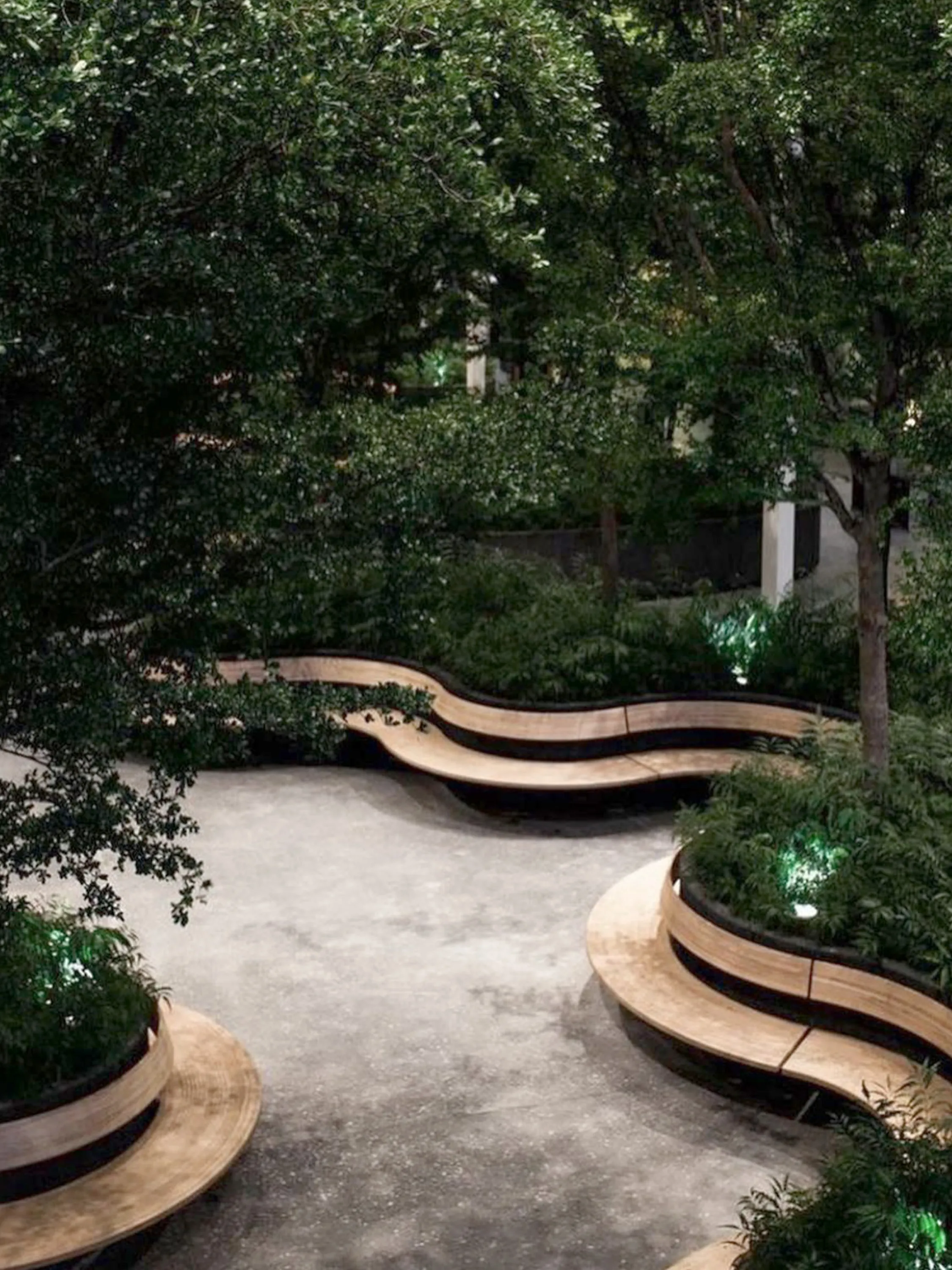 Communal area with rounded benches creating individual refuge areas.