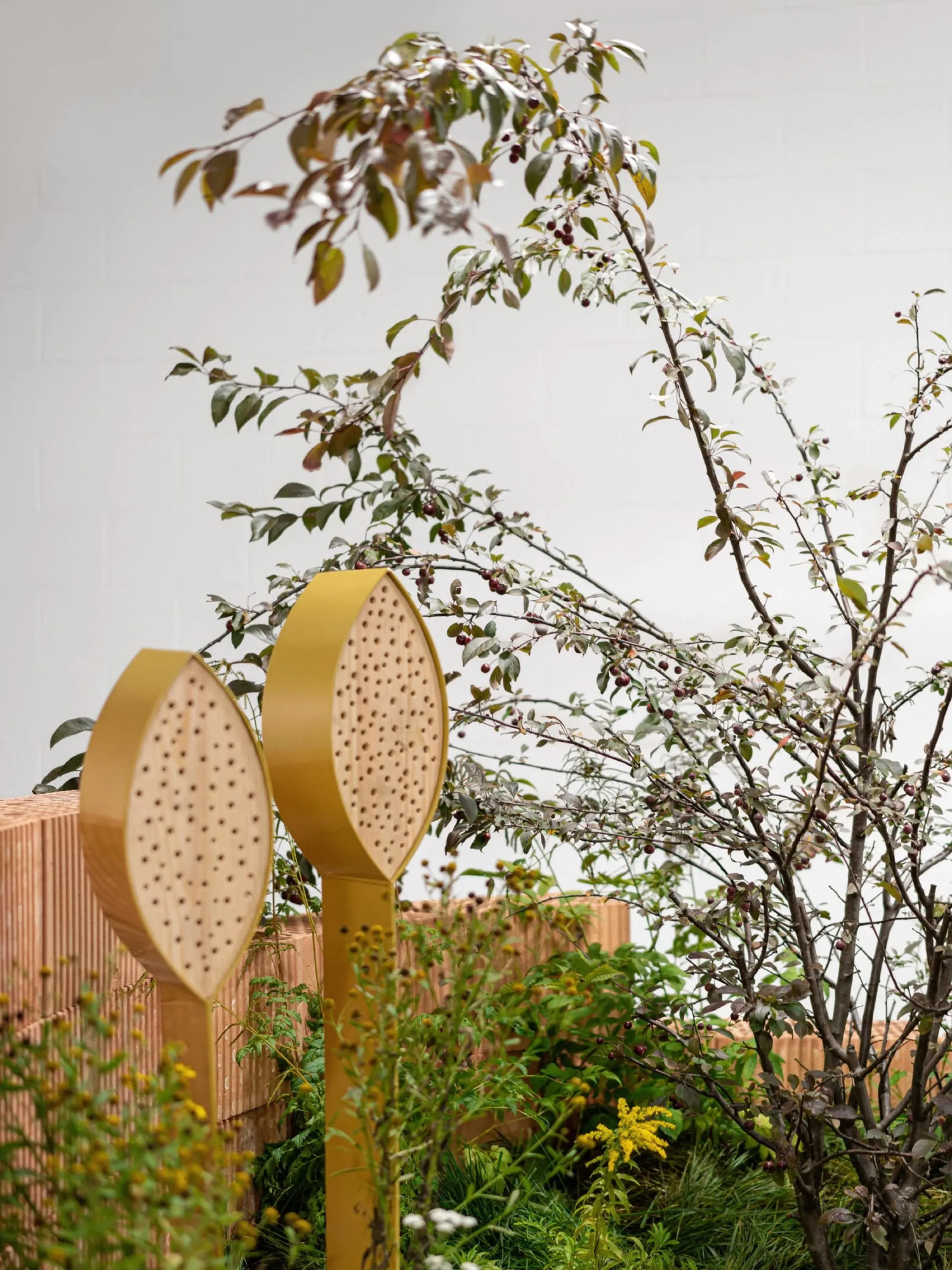 Fair booth incorporating hollow bricks and real plants.