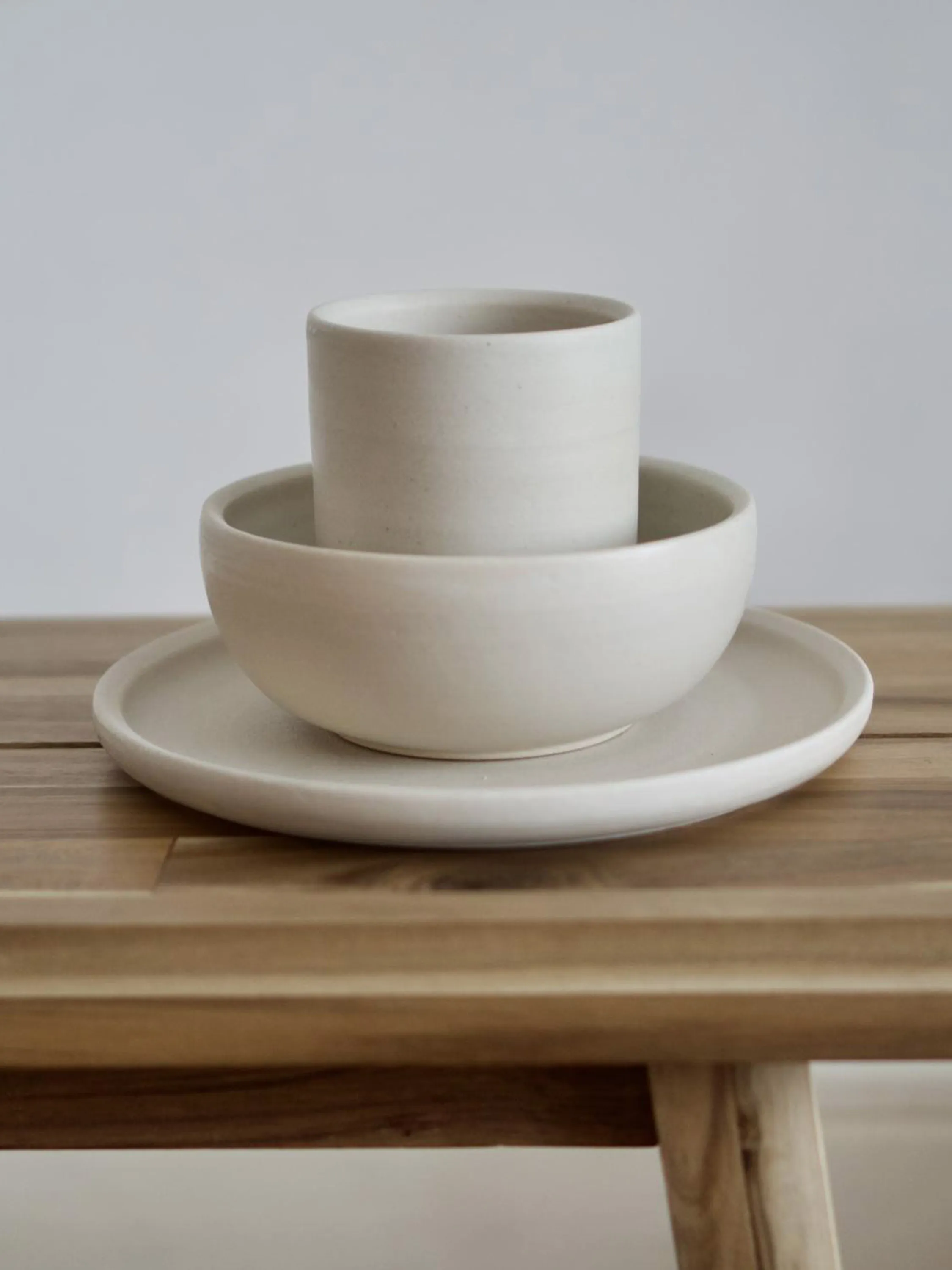 Plates and cups on a table.
