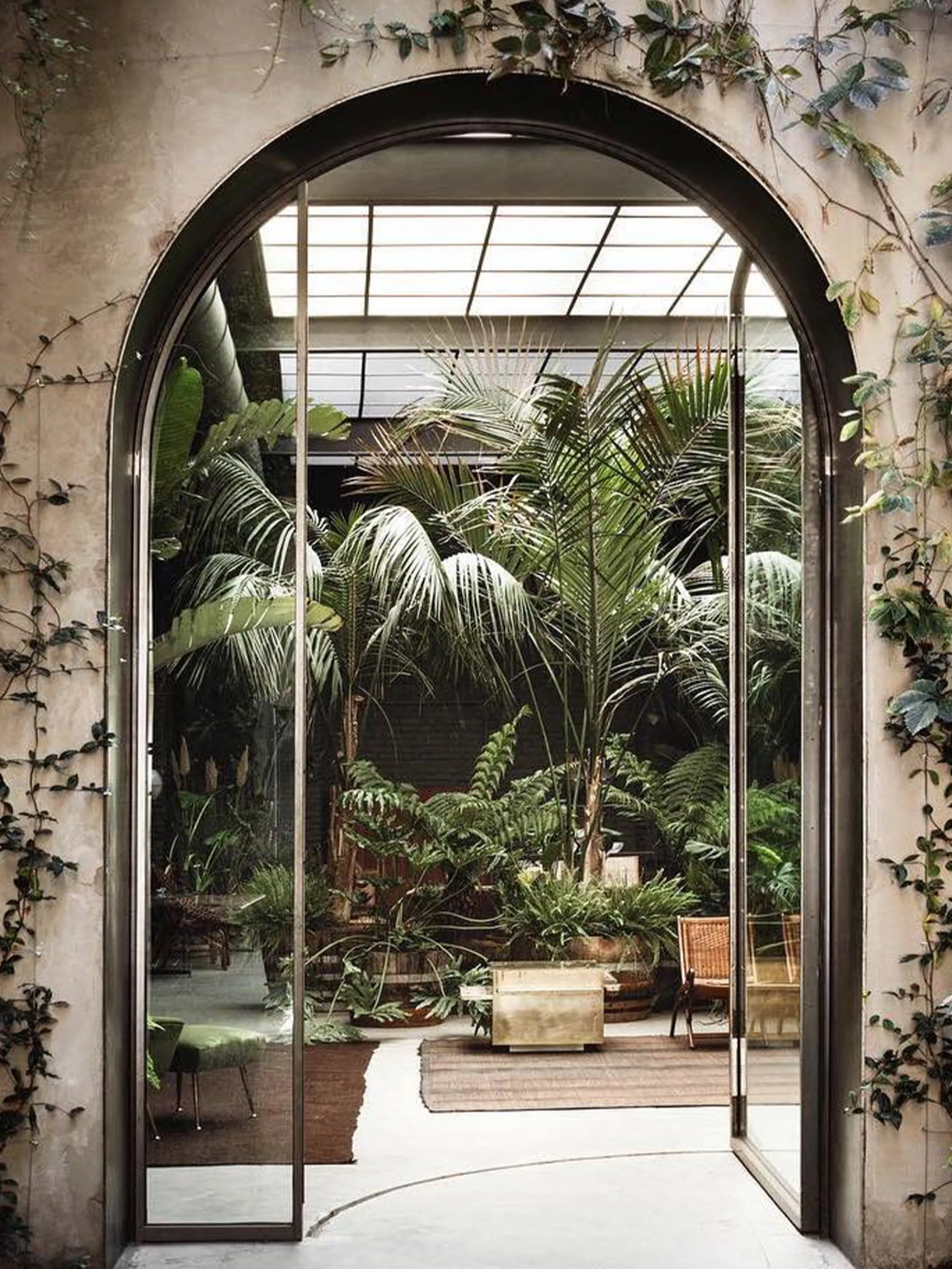 View of the bright indoor through the arched entrance door.