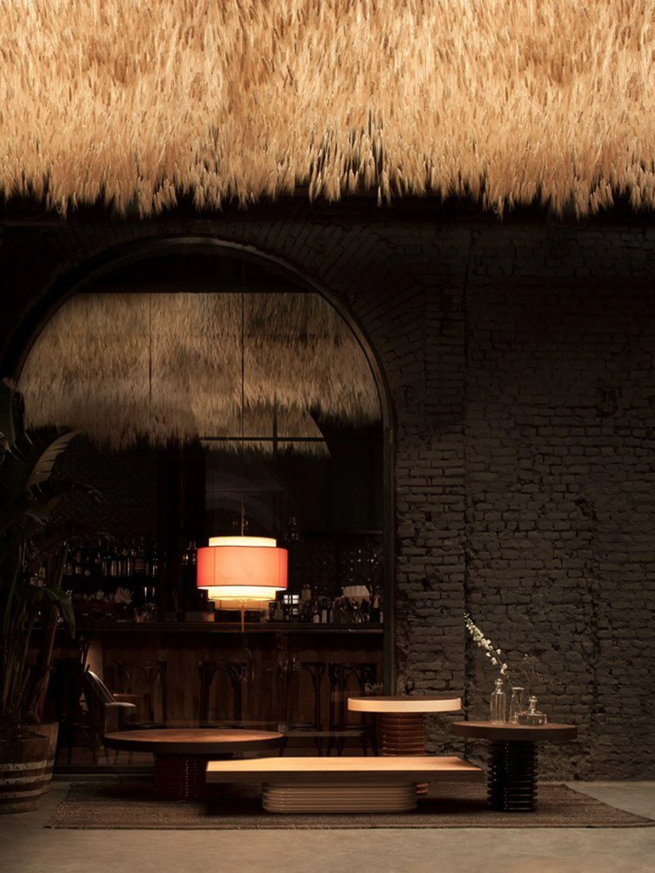 Wheat spikes hanging from the ceiling zone a conversation area.