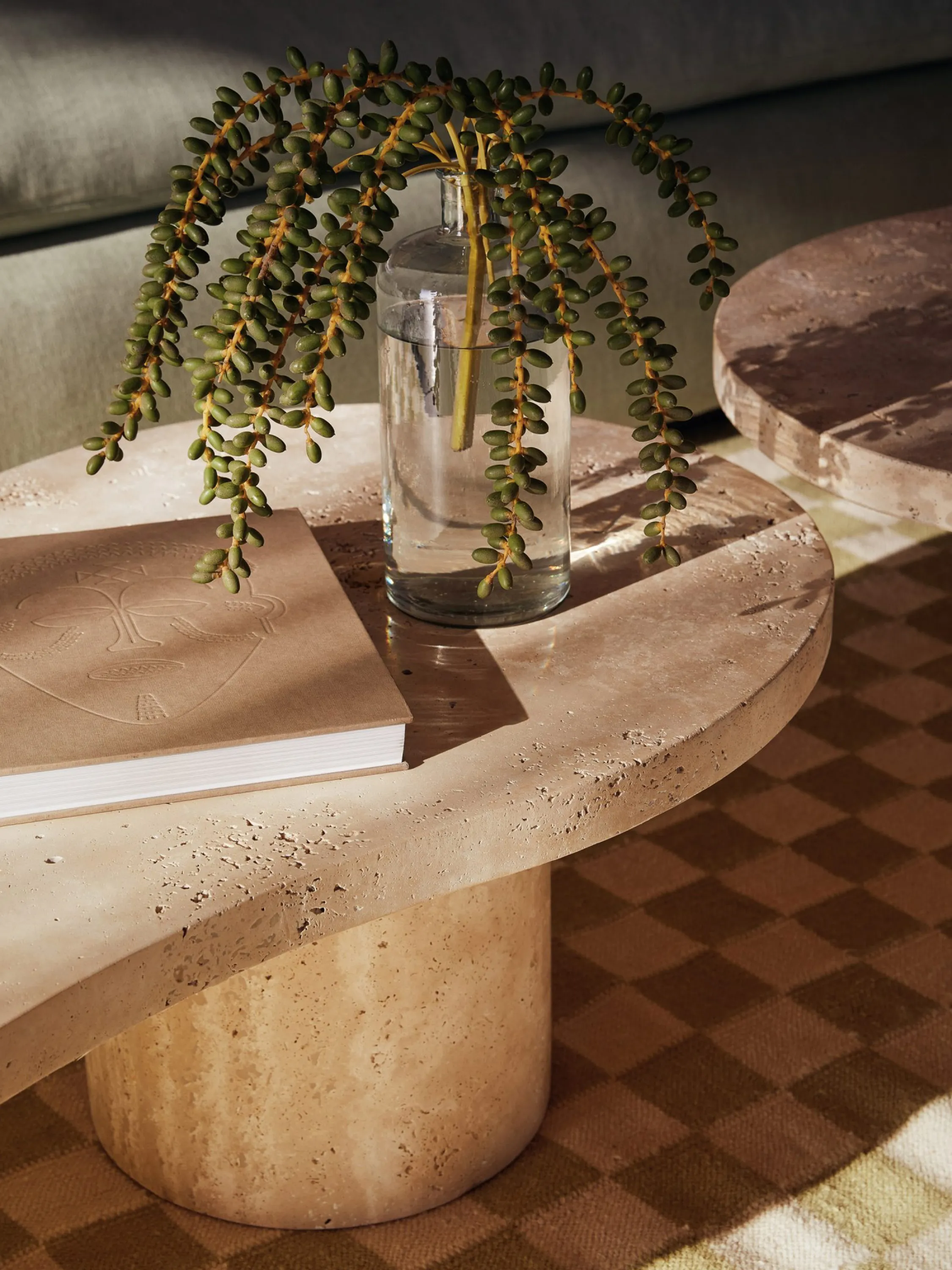Natural stone side table with elements of local identity in the styling.
