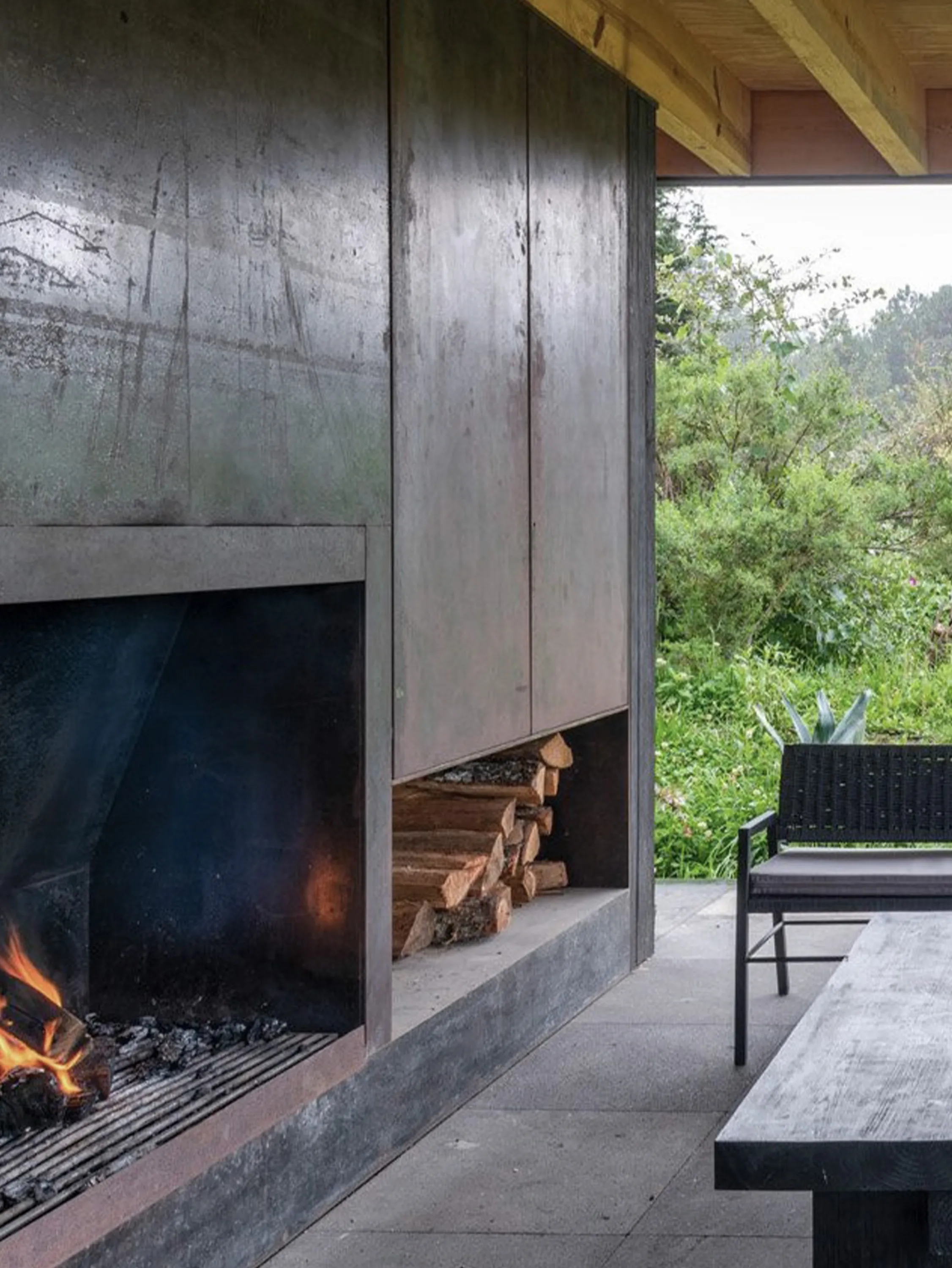 The outdoor space with a fireplace.