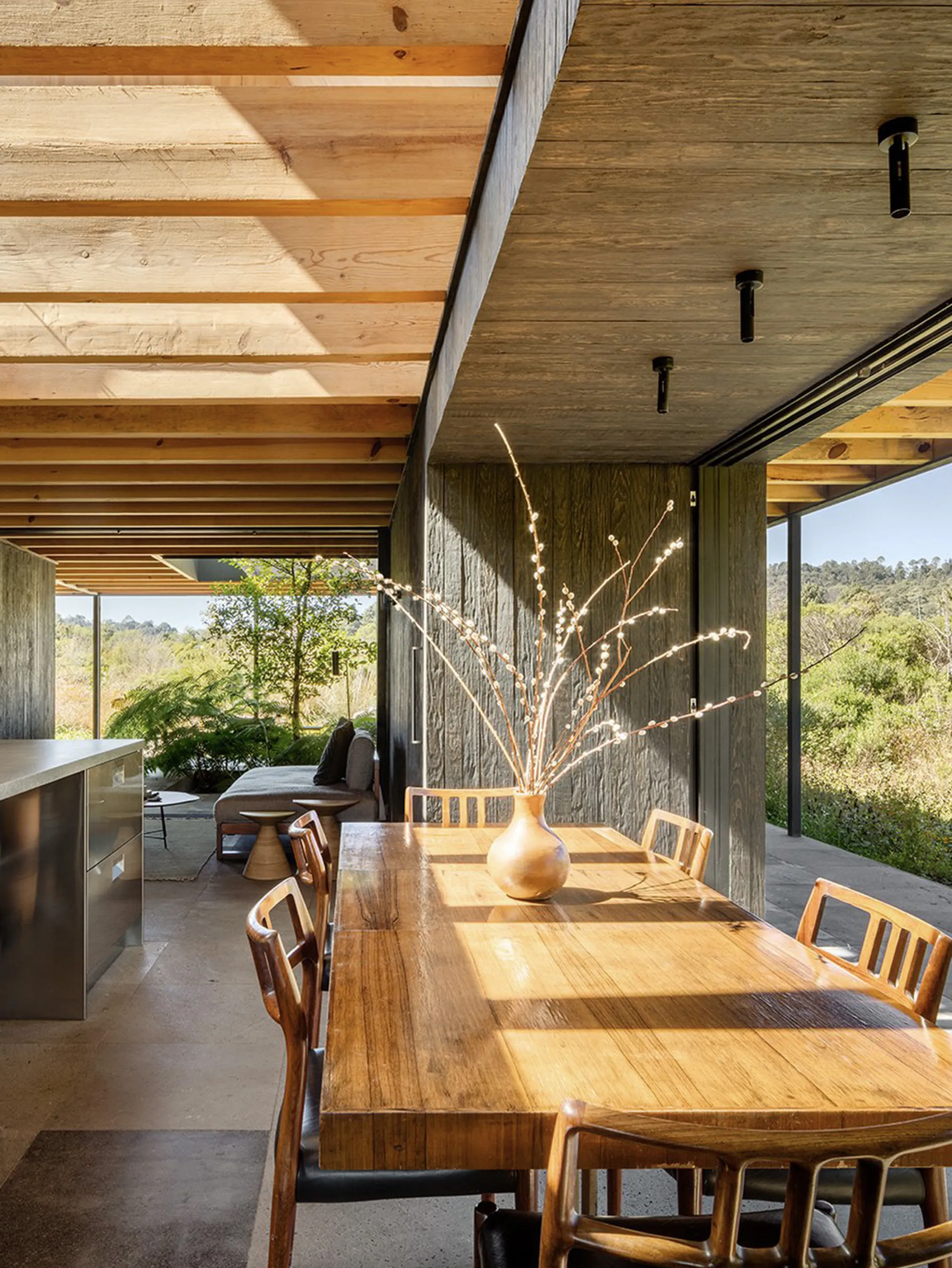 The kitchen and dining area, open to the exterior space.