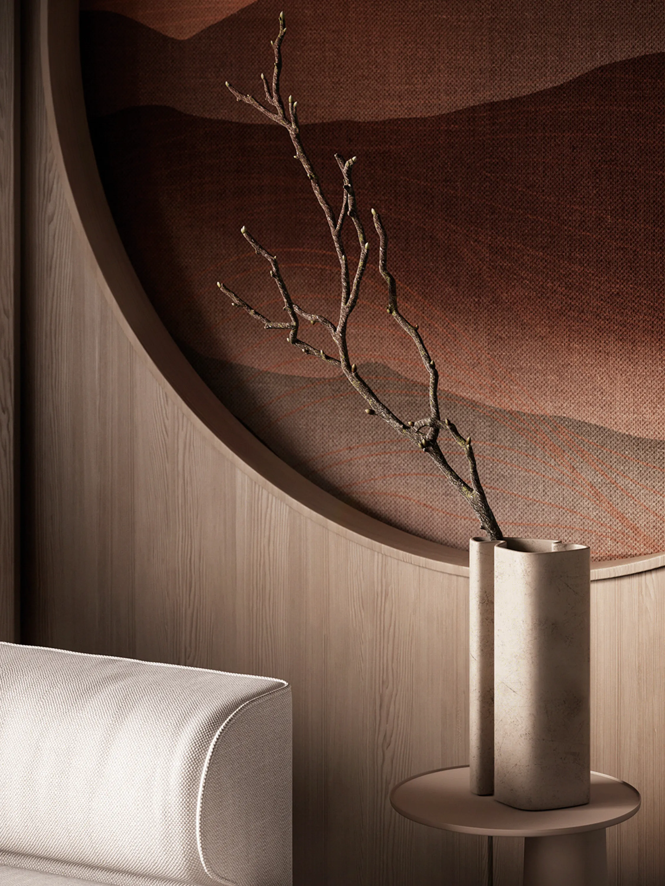 Curved wall feature with a branch styled in front of it.