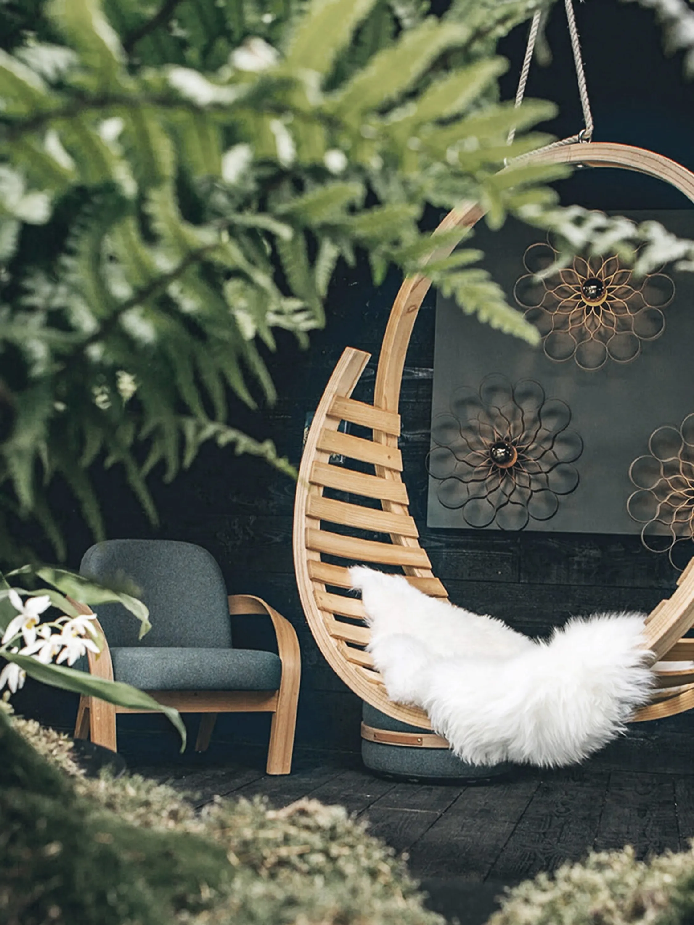 Outdoor trade show booth with furniture merging with the landscape.