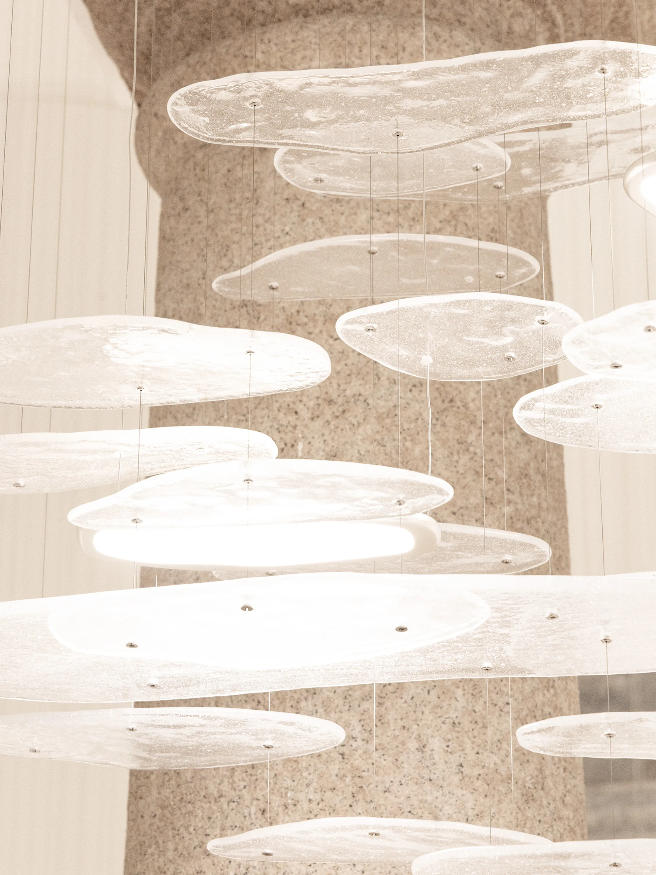 Glass light fixture against a period stone column.