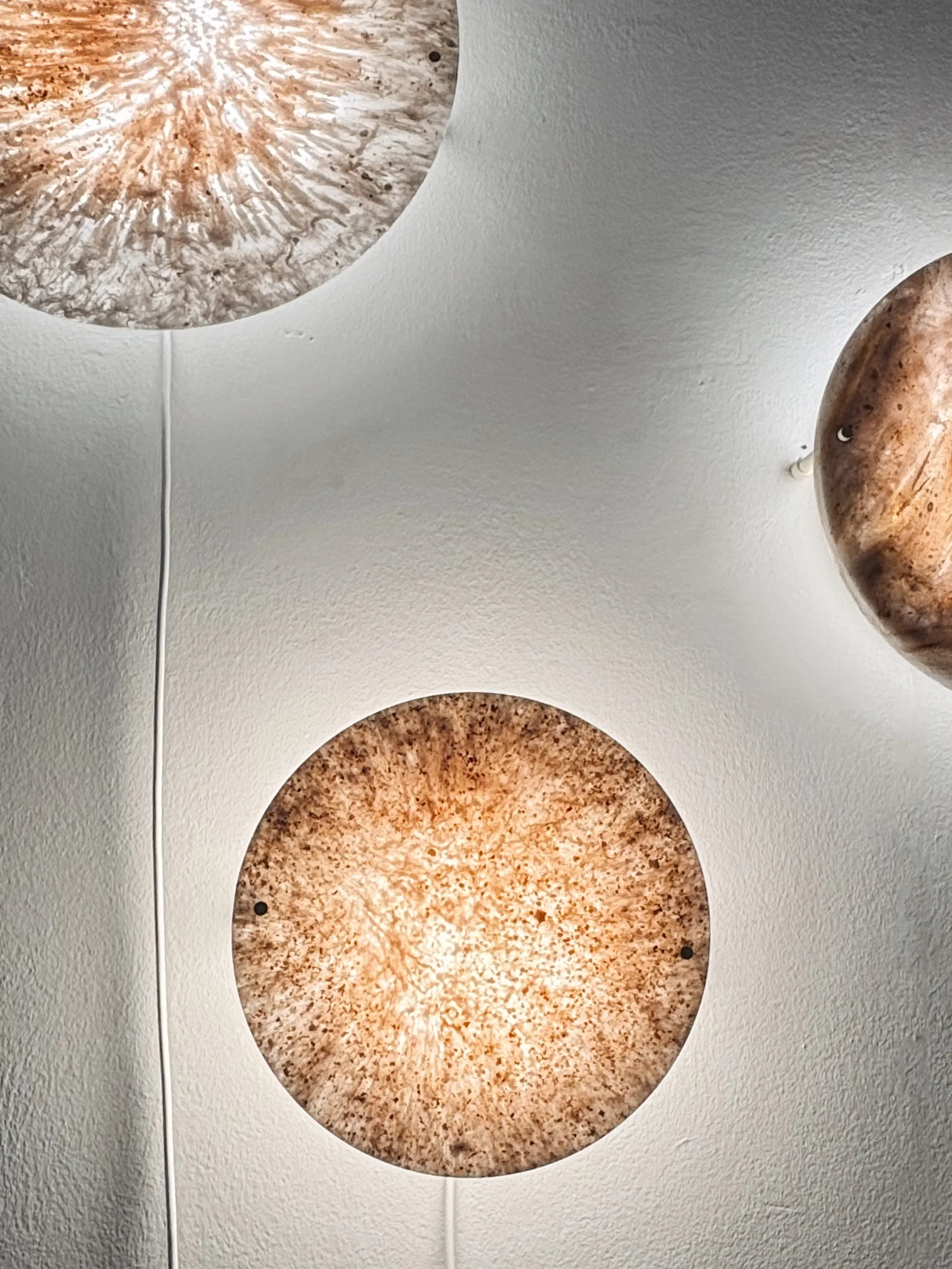 Sconces with marble-like texture.