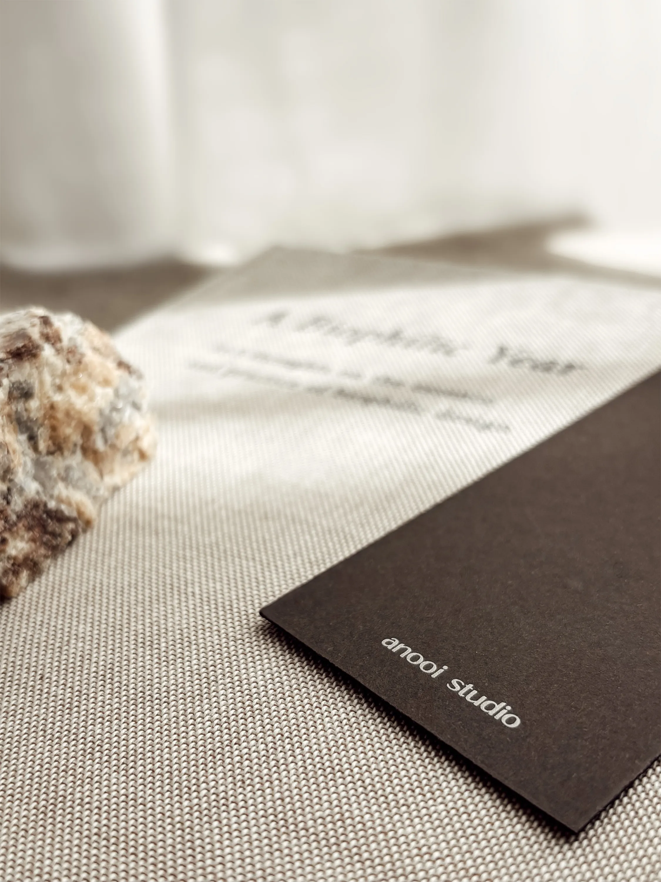 Logo detail on A Biophilic Year's bookmark: anooi studio.