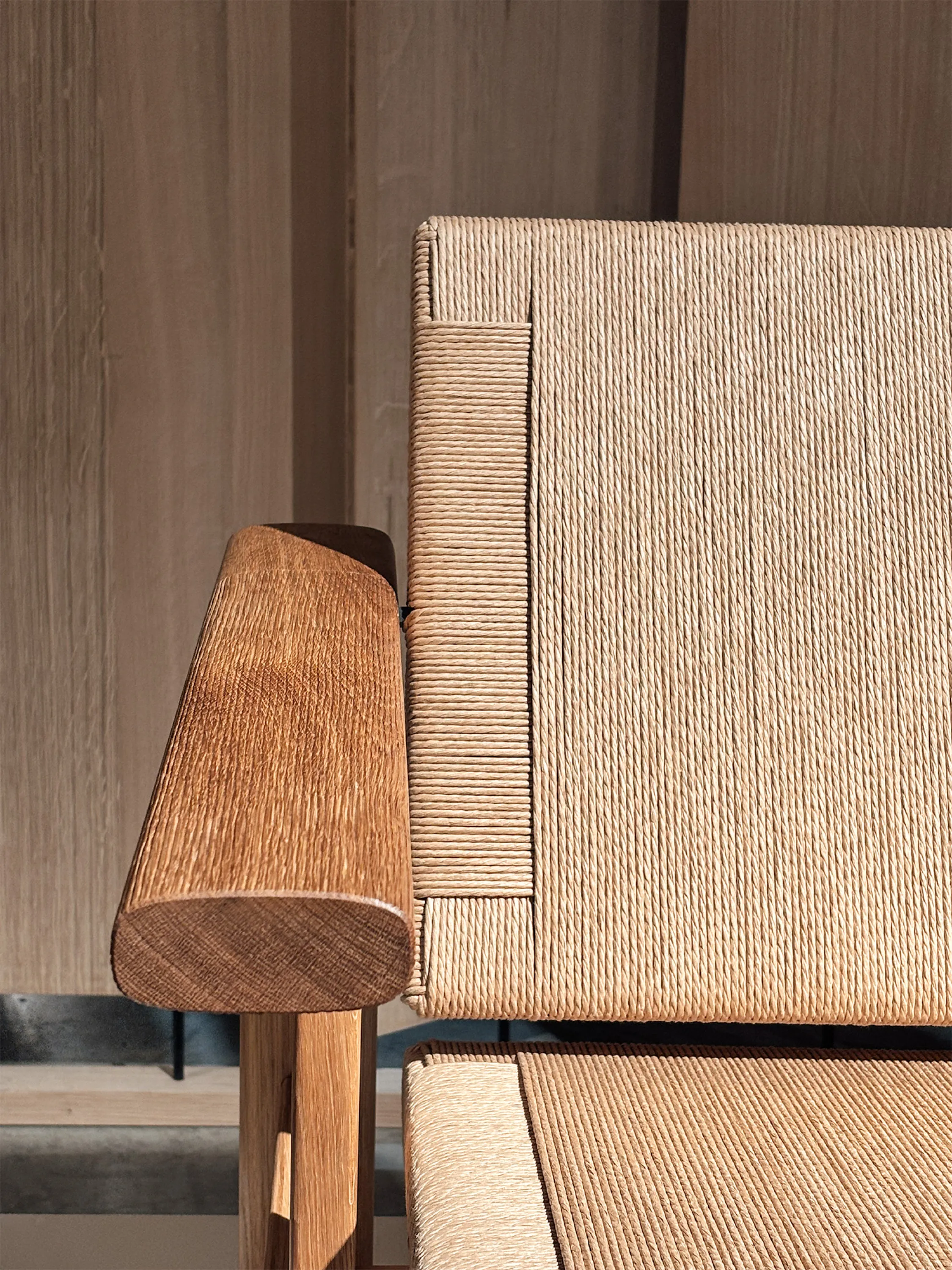 Detail of a hand-carved wood armchair.