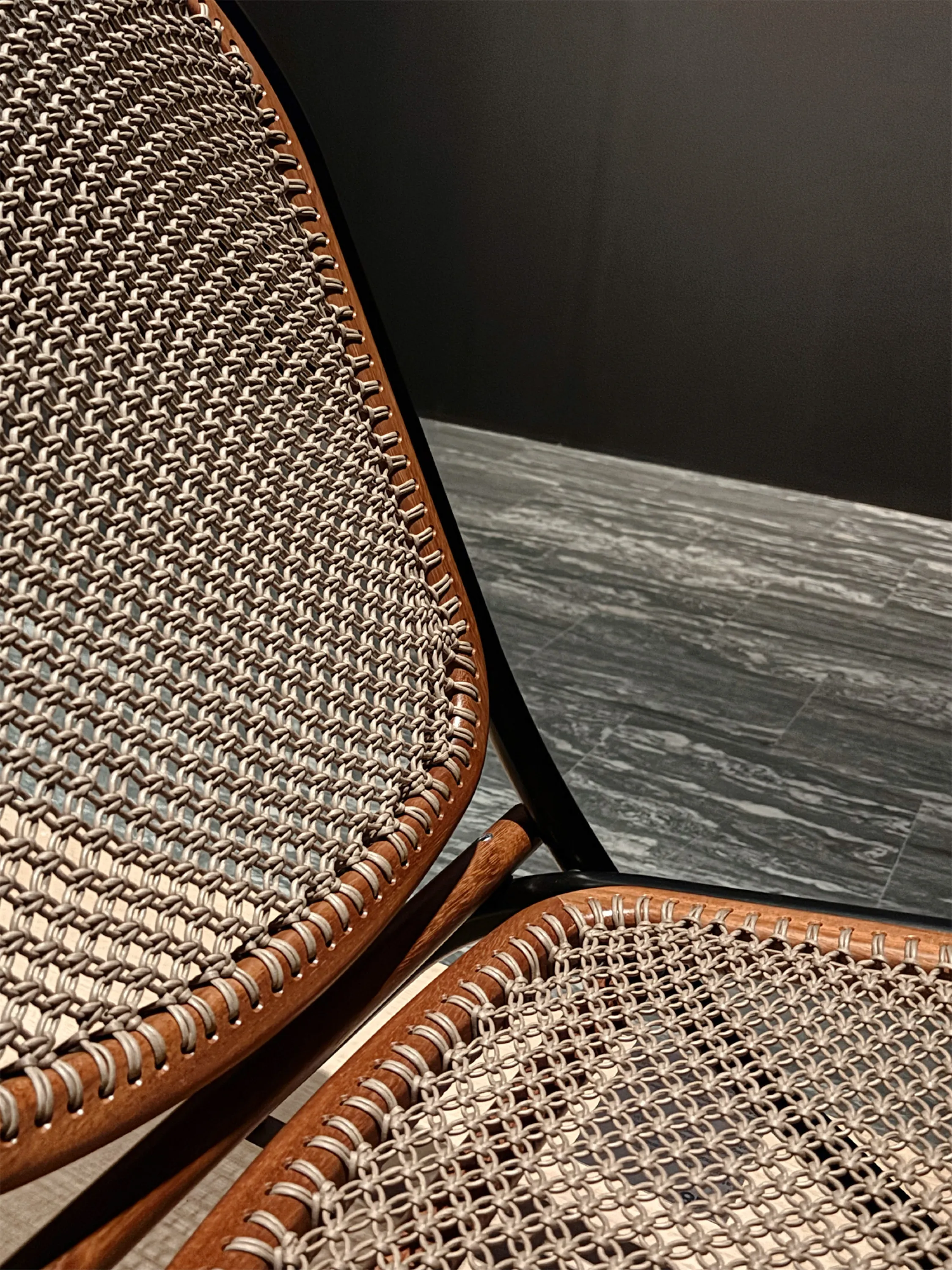 Detail of a chair's woven back and seat.