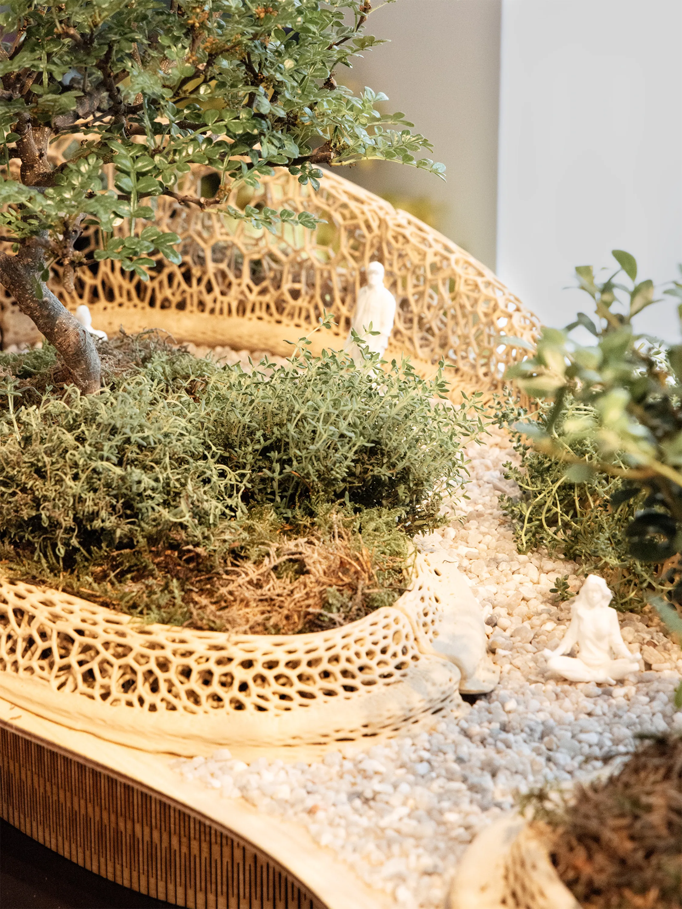 Model for urban street redesign including plants and a variety of seating options.