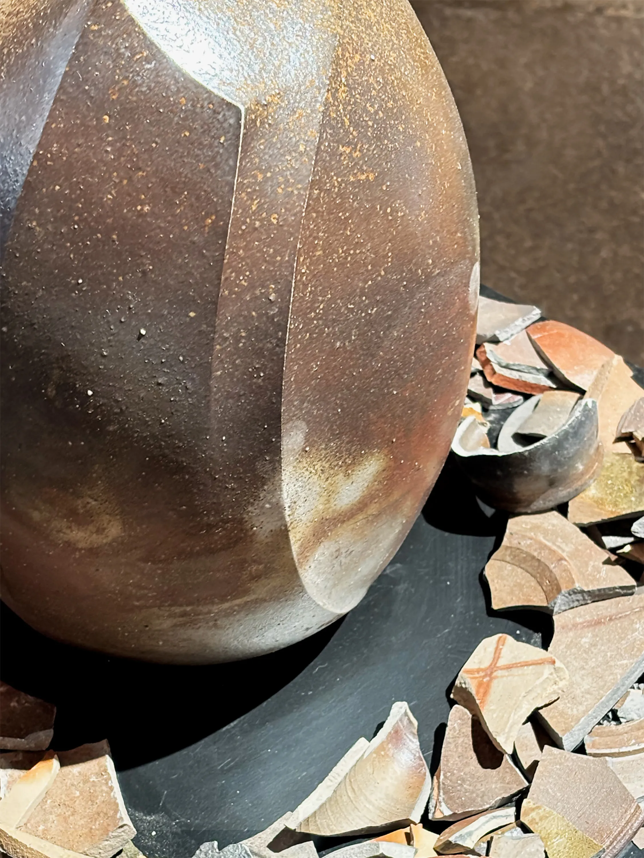 Recycled clay vase with a rich surface.