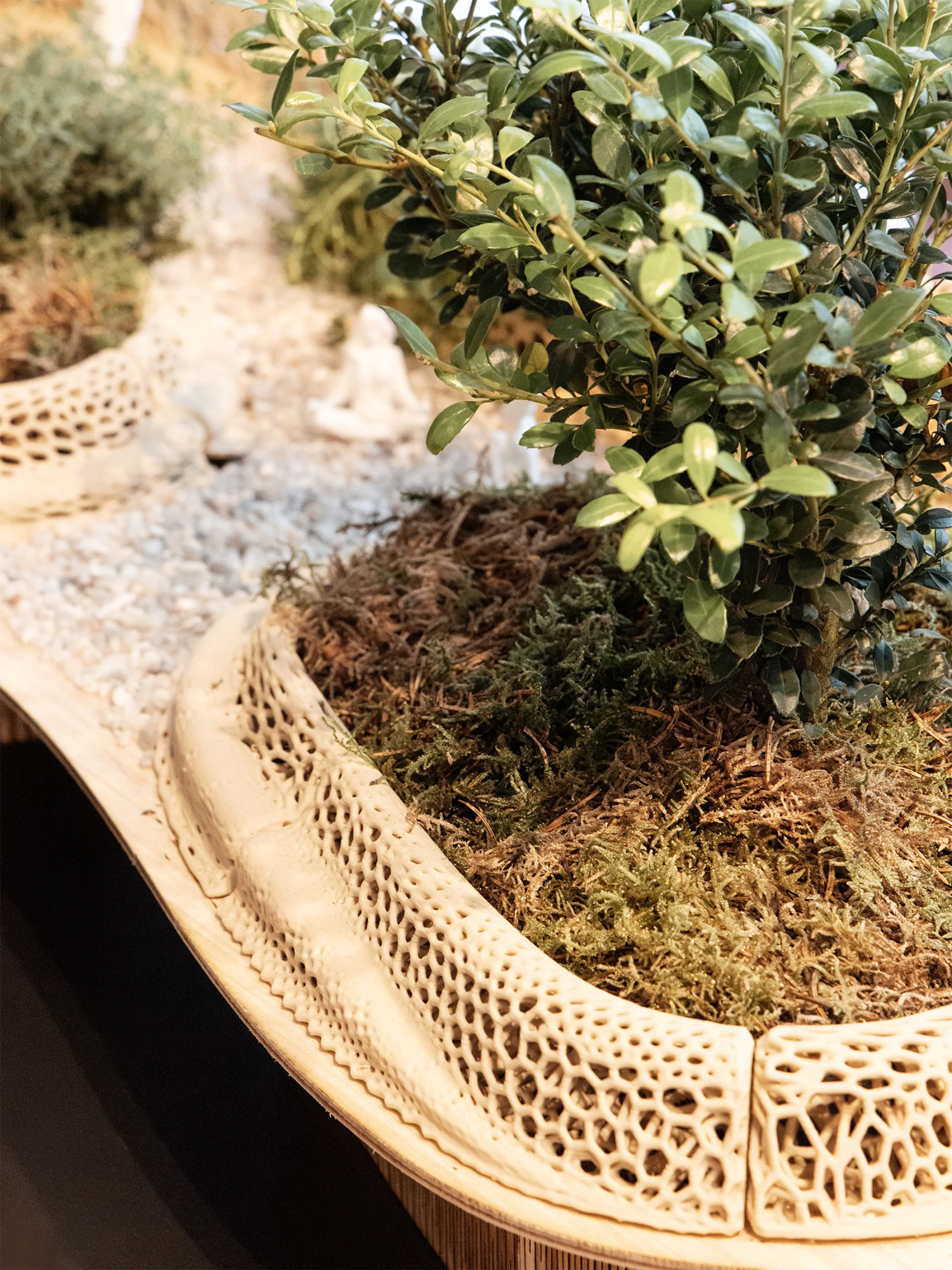 Detail of a model for urban street redesign including plants and a variety of seating options.