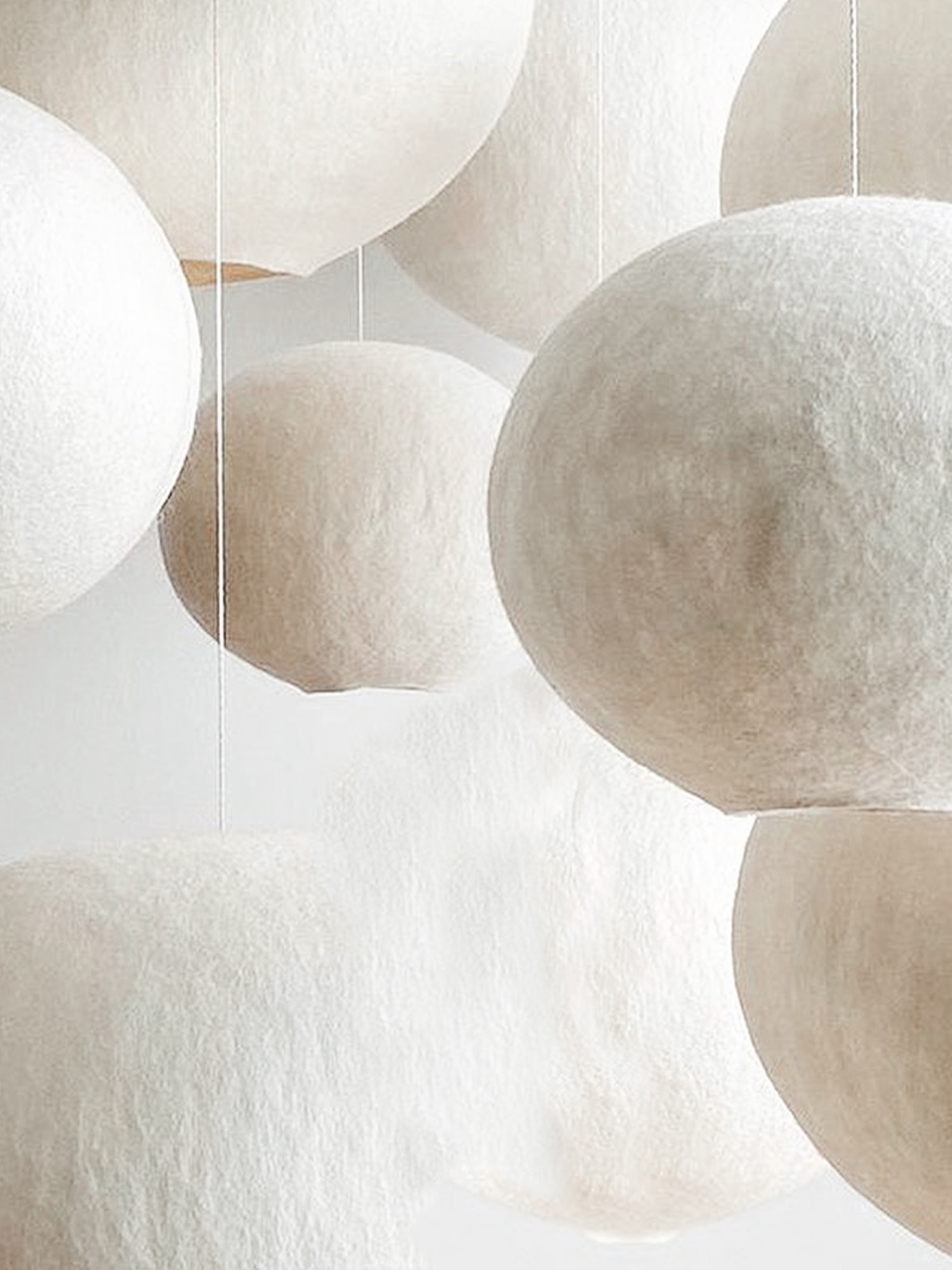 Cluster of white felted wool pendant lights